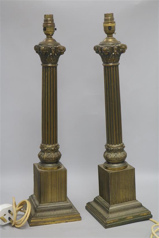 A pair of gilt corinthian column lamps